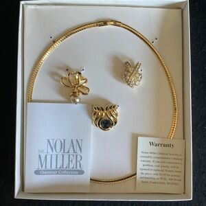 Nolan Miller gold tone omega slide necklace.